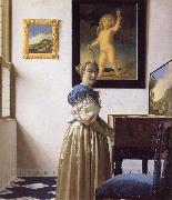 JanVermeer A Young Woman Standing at a Virginal oil painting reproduction